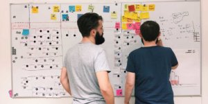 two men at whiteboard agile team project management